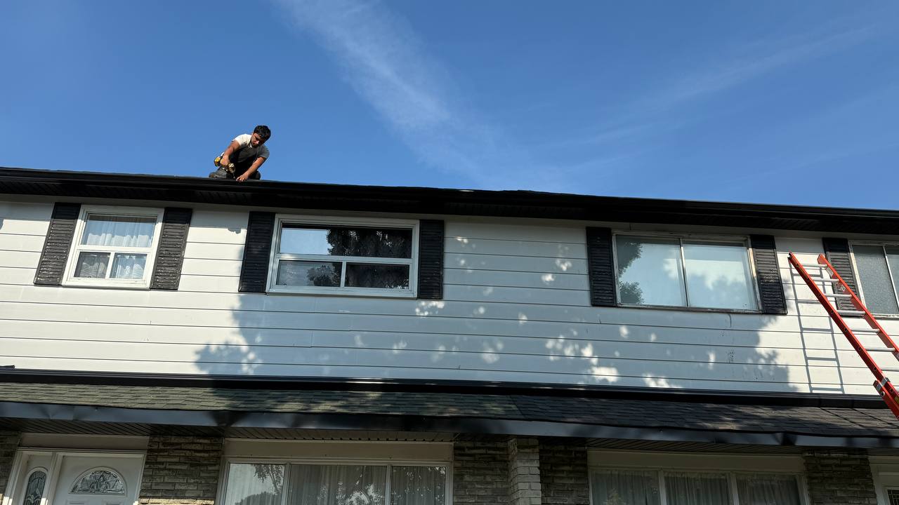 Dark asphalt shingle roof detail